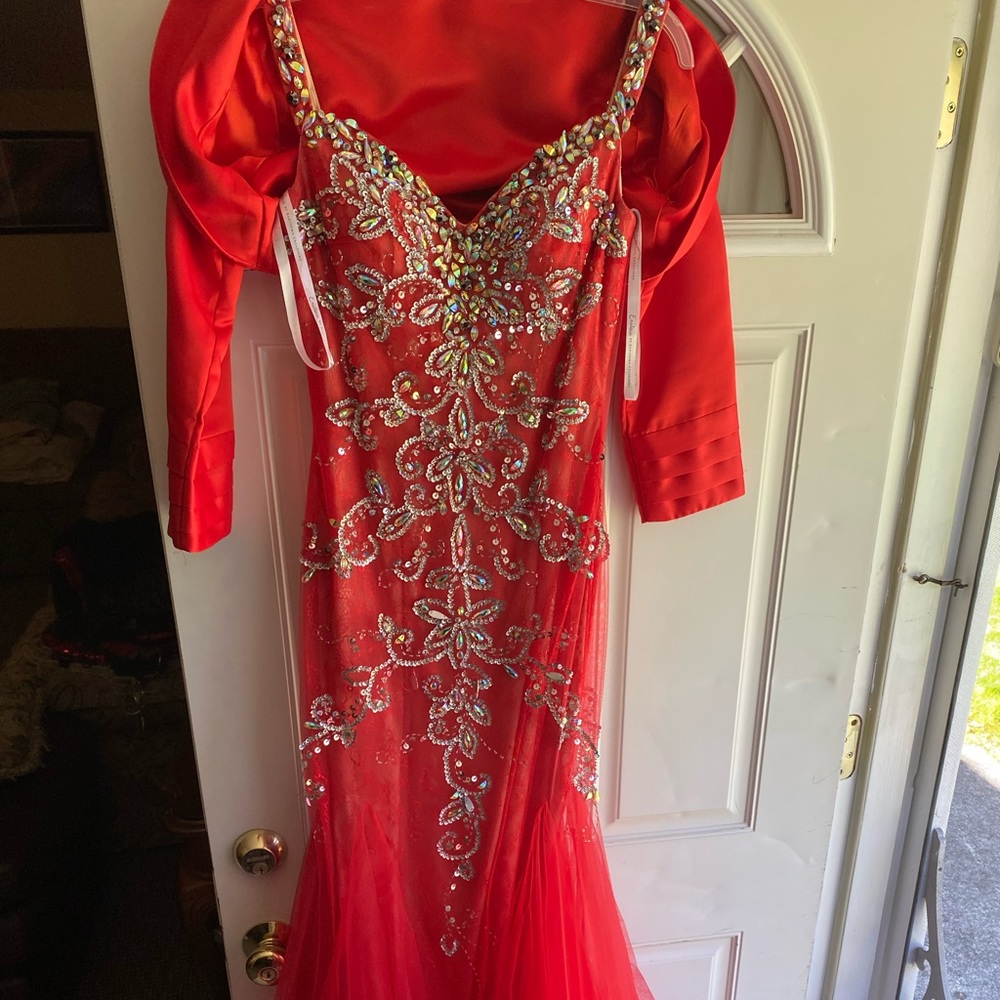 Selling a red dress. The size is a 6. Dress is from a very nice boutique.